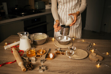 A close-up of the process of making New Year's gingerbread cookies in an atmospheric kitchen at home. Christmas mood