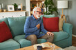 © Stockphotodirectors - A senior man suffering from chest pain or heart attack at home