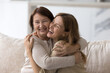 Happy loving elder mom embracing beautiful adult daughter woman with joy, tenderness, smiling, laughing at joke together, giving comfort, support, care, enjoying being parent, motherhood