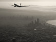 a black and white photograph of an airplane flying over a megacity from the 1980s, in the style of light brown and silver, tenwave, dignified poses, detailed world-building, american regionalism