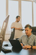 © amixstudio - Portrait of two professional male programmers working on computer in diverse offices. Modern IT technologies, development of artificial intelligence, programs, applications and video games concept