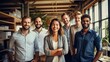 Diverse creative team looking happy. Diverse working culture group of persons is in their startup office wearing informal clothes people are smiling most persons are standing.