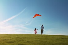 Father And Daughter Fly A Kite.