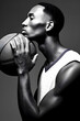 © Demencial Studies - African American basketball player with basketball, black and white portrait