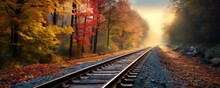Railway Tracks In Autumn Landscape