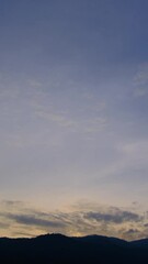 Wall Mural - Twilight and dawn sky with cumulus cloud vertical time lapse in an evening.