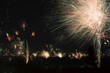 Large firework exploding in the night sky over trees in a wooded area