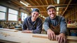 Two young smiling carpenter boys working in the carpentry shop