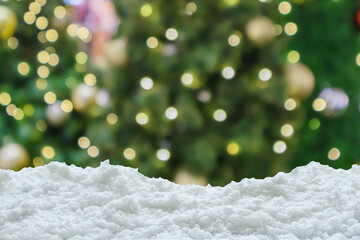 Wall Mural - Empty white snow with blur Christmas tree with bokeh light background