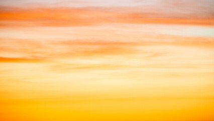 Wall Mural - The dramatic colors of the sunset in the sky gradient from blue to orange.