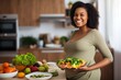 pregnant woman smiling and eating a plate of healthy food containing vegetables and fruits