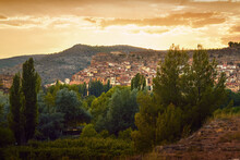 View Of The Village Of Ademuz In Spain Illuminated By A Reddish Sunset Sky
