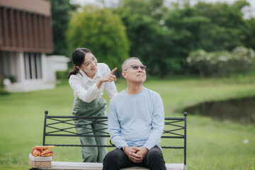 Asian woman caring for elderly patient