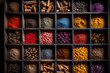 Especias de multiples colores en sacos, tarros y cajas viejas