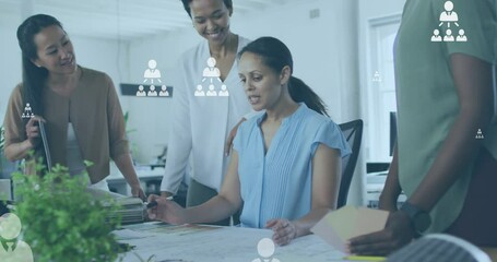 Wall Mural - Animation of profile icon flowcharts over diverse female architect sharing ideas with coworkers