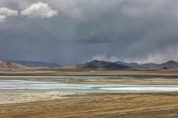 Wall Mural - Stunning landscape in the Ali region of Tibet, with majestic mountains and a tranquil blue lake