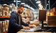 Focused Warehouse Operator Checks Inventory at Computer