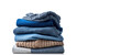 © Алена Ваторина - Stack of clothing jeans sweaters on a white background