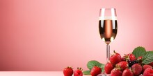 Minimalistic Composition With Wine Glass Of Champagne And Strawberry Berry On Pink And Mint Background With Bokeh Effect. Romantic Summer Background With Alcohol Drink. Copy Space.
