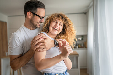 Happy adult caucasian couple at home husband and wife family concept