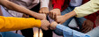 © Summit Art Creations - Startup company employee team stacking hand together symbolize successful group of business partnership and strong collective unity teamwork in community workplace in panoramic banner. Synergic