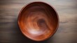 A beautifully crafted wooden bowl on wooden table, Top view of handcrafted empty Wooden Bowl on a plain surface 