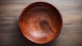 Fototapeta  - A beautifully crafted wooden bowl on wooden table, Top view of handcrafted empty Wooden Bowl on a plain surface 