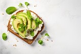 Fototapeta  - Healthy avocado open sandwich on white stone table