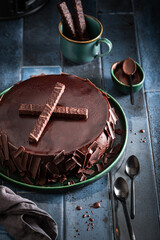 Wall Mural - Delicious chocolate cake with dark chocolate bars.