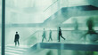 © kichigin19 - light blurred green background eco business center, office building inside interior, silhouettes of people blurred in motion