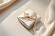 © Lumos Maxima - Minimalist modern looking gift box tied on smooth beige background