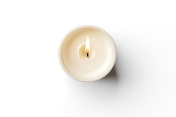 Burning wax candle on white background, top view.