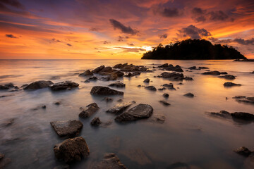  Tranquil sunset over rocky coastal landscape, reflecting beauty in nature at Pulau Sayak Kuala Muda Kedah Malaysia