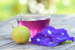 Butterfly pea lime juice on wood table with blur background, health drinks