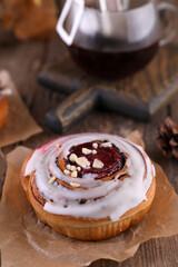 Wall Mural - Pastries and coffee in a drip bag on a wooden table.