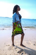 © selcukbulbul - woman walking on the beach