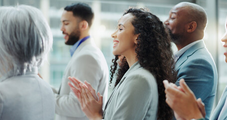 Wall Mural - Celebration, business woman and clapping at a conference with teamwork and motivation in office. Discussion, staff and collaboration with professional team at a seminar with workforce and achievement