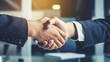 © Farid - Hands of business colleagues shaking hands at work place. Made with generative ai