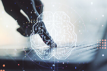 Wall Mural - creative artificial intelligence concept with human brain hologram and hands typing on laptop on bac