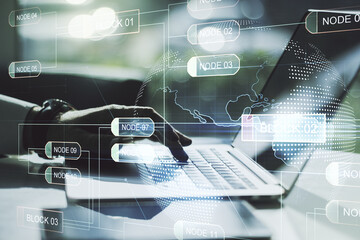 Wall Mural - double exposure of abstract programming language hologram with world map and hands typing on laptop 