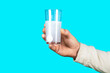 Glass of water tablet. Glass with effervescent tablet in water with bubbles. White pill and a glass of water in man hands. Health concept. Close up of man holding a pill
