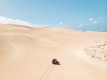Aerial View Of A Car Driving On Sand Dunes In Port Lincoln National Park, South Australia.