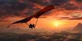 Silhouette of hang gliding on clouds at sunset, Extreme sports concept