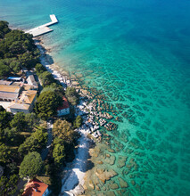 Aerial View Of Crystal Clear Water Along The Coastline With Rocky Seabed On Veliki Brijun Island, Brijuni National Park, Istria, Croatia.