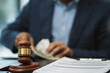 © NINENII - Lawyer accepts money, bribes businessman for partner in corruption in workplace.