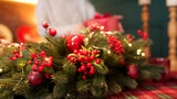 Fototapeta Tulipany - A young girl collects gifts for her relatives in the kitchen on Christmas evening. Christmas and Happy New Year concept at home.