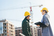 © Aleksandar - Engineers at construction site having a discussion
