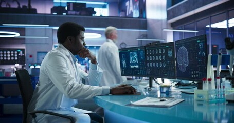 Aufkleber - Black Male Neuroscientist Using Desktop Computer To Analyze MRI Scans Of Brain In Medical Research Center Laboratory. African Doctor Studying CT Scan Of Stroke Patient's Brain, Finding Solutions.