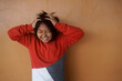 © Hendra Fauzy - Annoyed little autistic Asian girl touching her head and showing angry expression