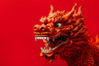 Traditional chinese dragon sculpture on red background with copy space. 2024 Chinese year of the dragon